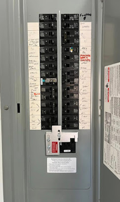 Electrical panel with organized breaker labeling and service work
